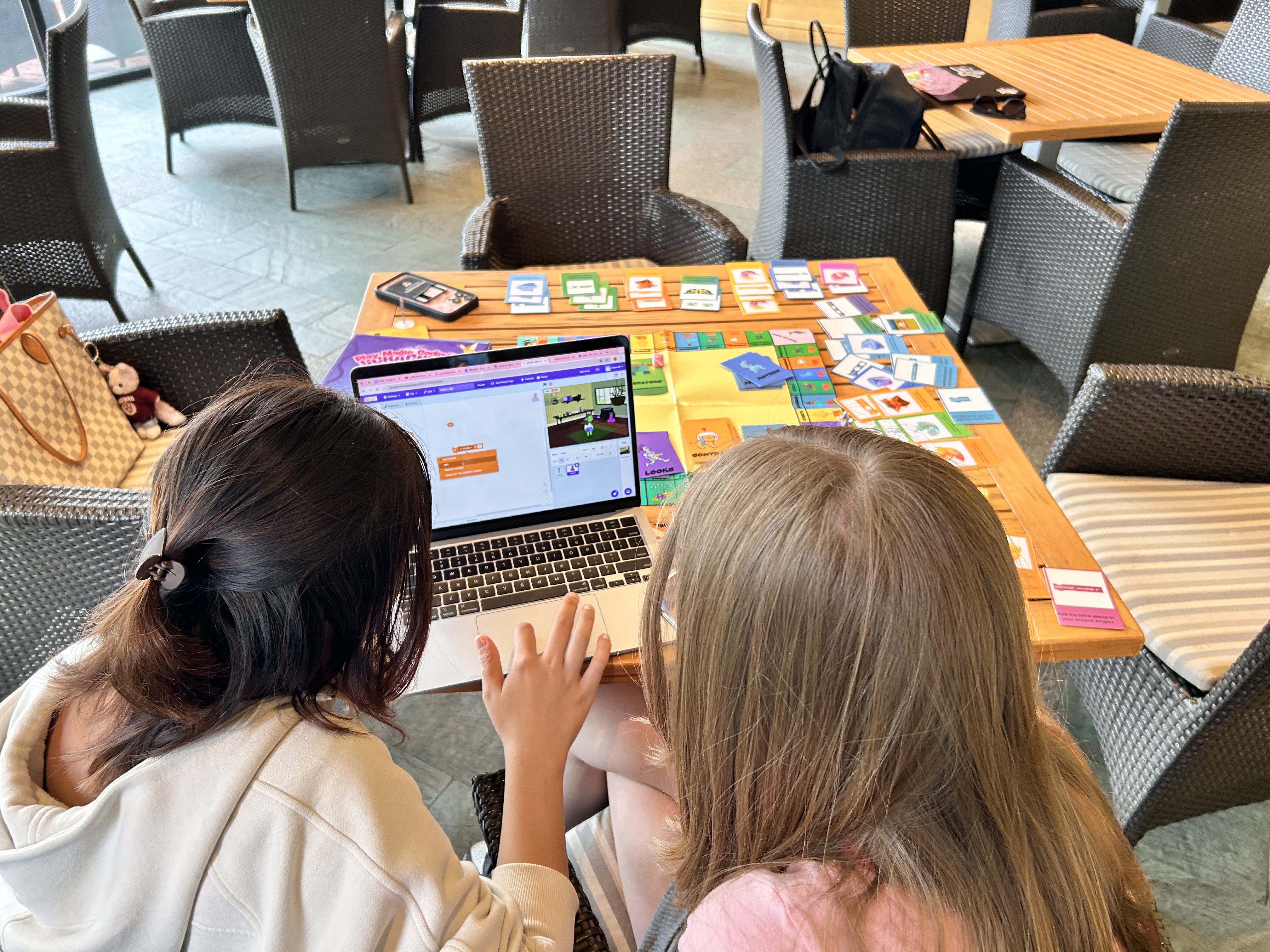 Children collaborating on computational thinking activities